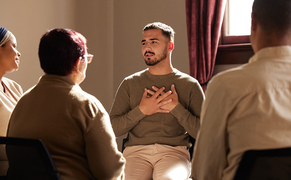 Support trust and man sharing in group therapy